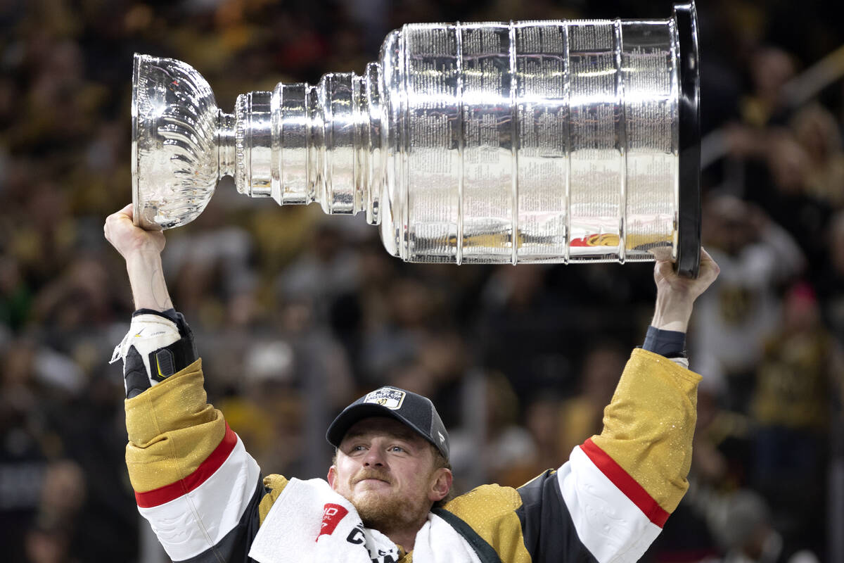 Golden Knights center Jack Eichel (9) celebrates with the Stanley Cup after winning the NHL hoc ...