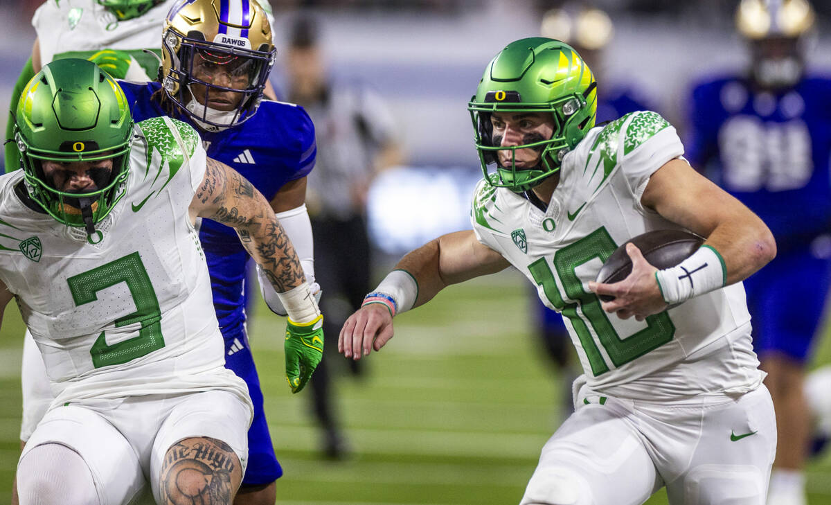 Oregon Ducks quarterback Bo Nix (10) looks for the end zone just short of a touchdown run again ...