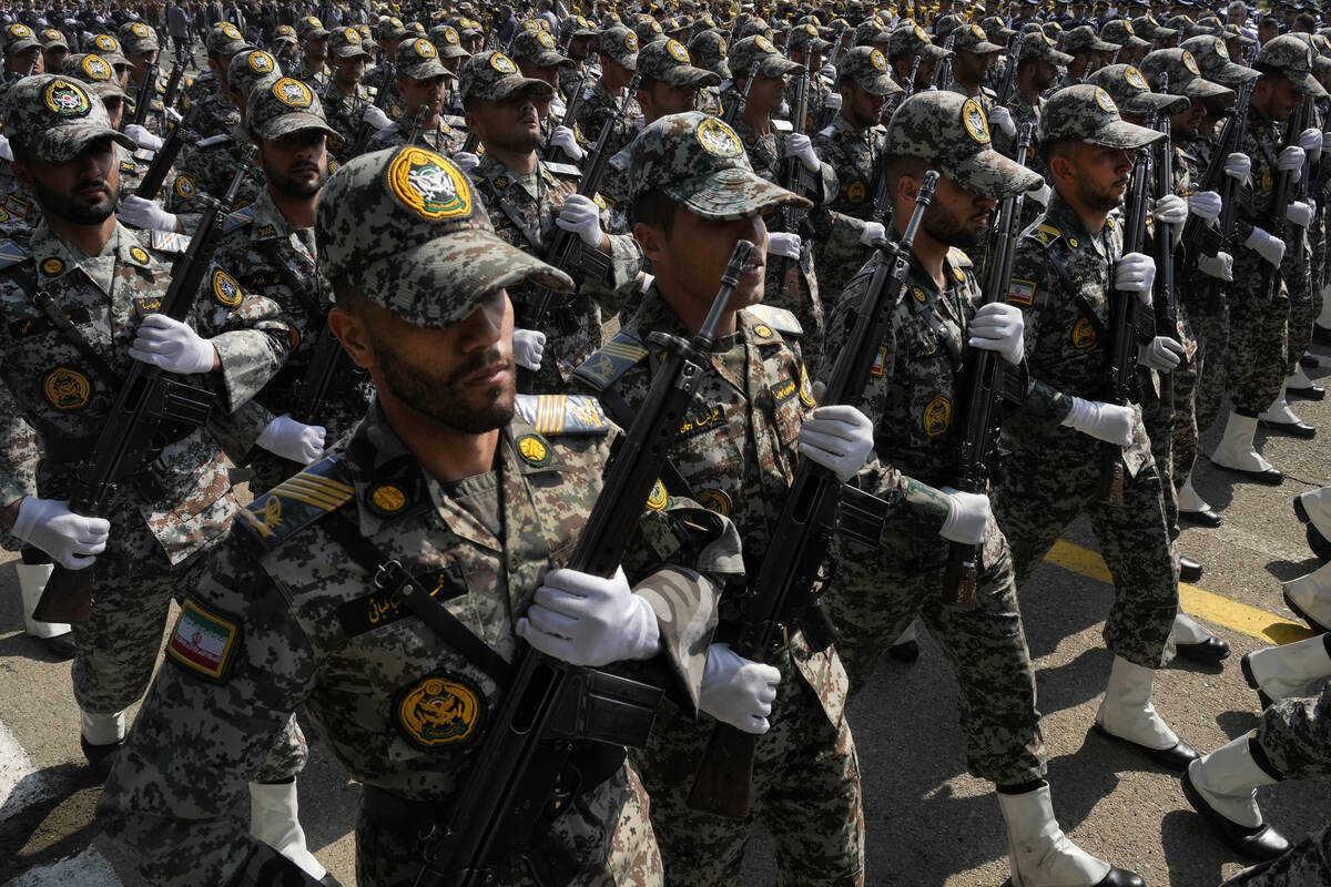 Iranian army members march during an Army Day parade at a military base in northern Tehran, Ira ...
