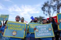Mail people shout “enough is enough” during a National Association of Letter Carr ...
