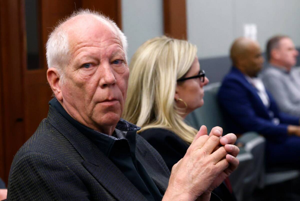 Developer Jim Rhodes enters a courtroom listens during a hearing at the Regional Justice Center ...