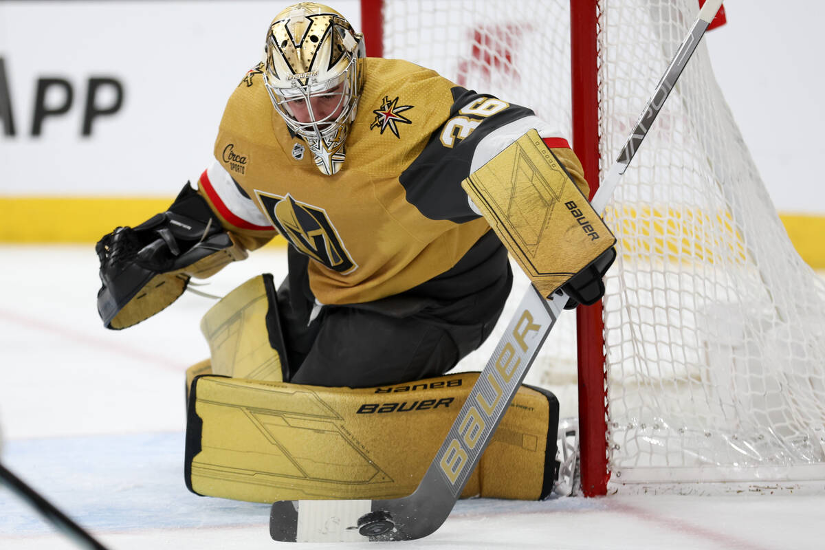 Golden Knights goaltender Logan Thompson (36) saves the puck during the second period of an NHL ...