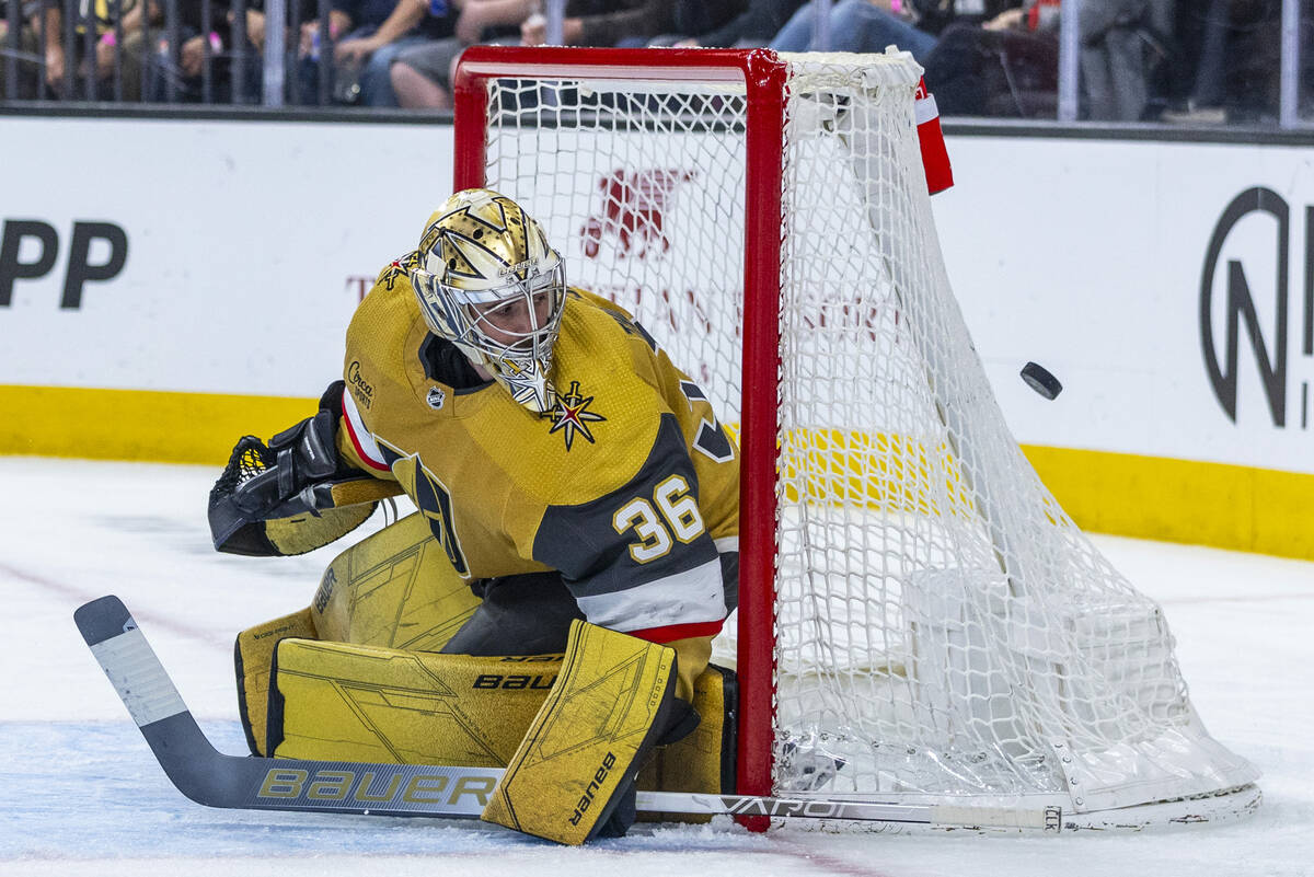 Golden Knights goaltender Logan Thompson (36) eyes a puck coming his way from the Chicago Black ...