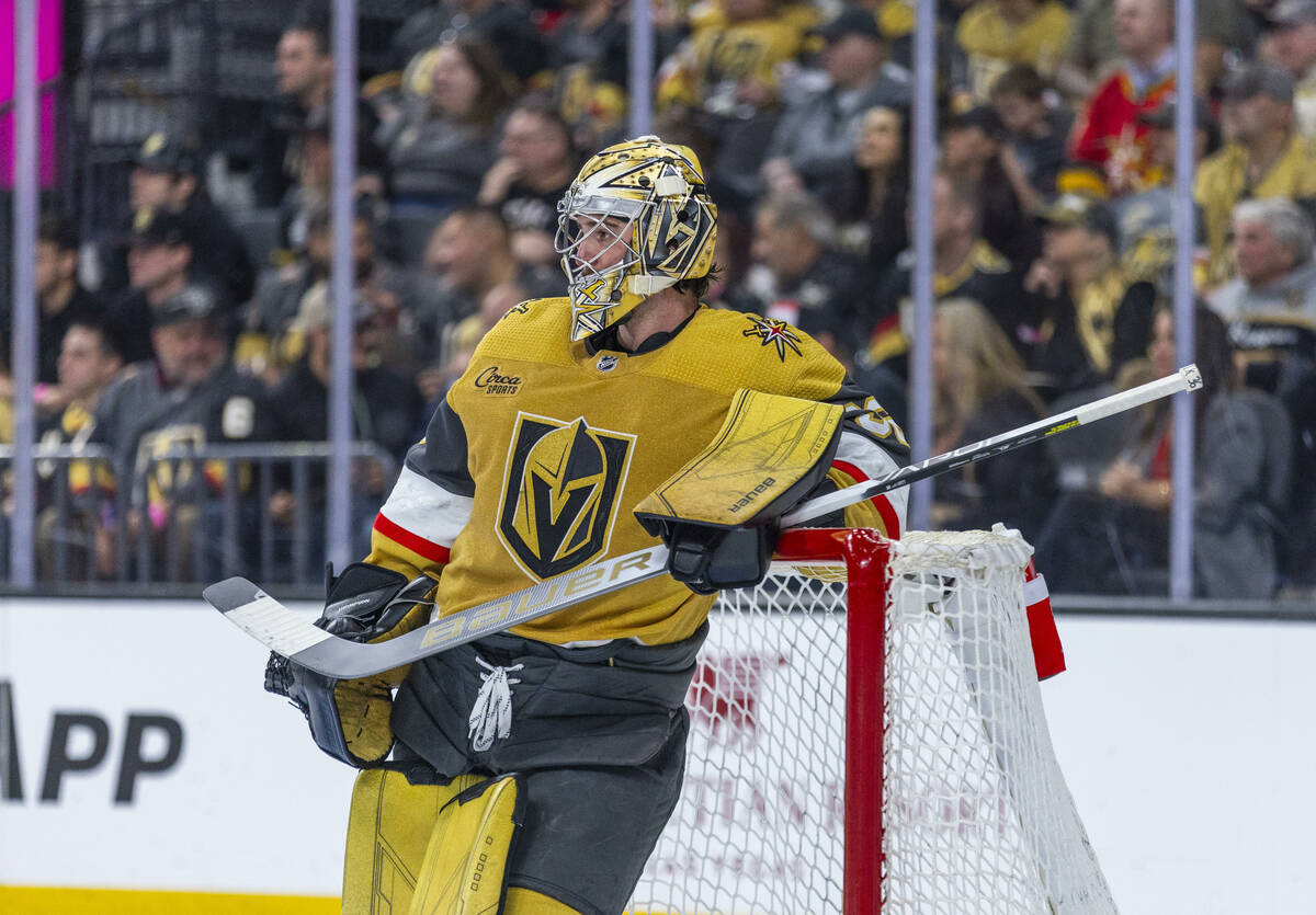 Golden Knights goaltender Logan Thompson (36) relaxes on the net during an icing call with the ...