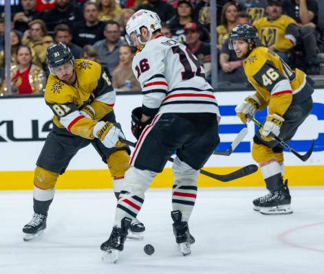 Golden Knights right wing Jonathan Marchessault (81) sends a shot between the skates of Chicago ...