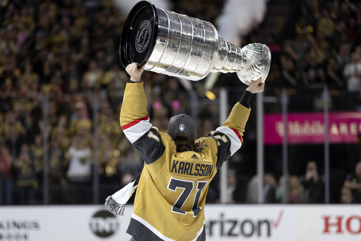 Golden Knights center William Karlsson (71) celebrates with the Stanley Cup after winning the N ...