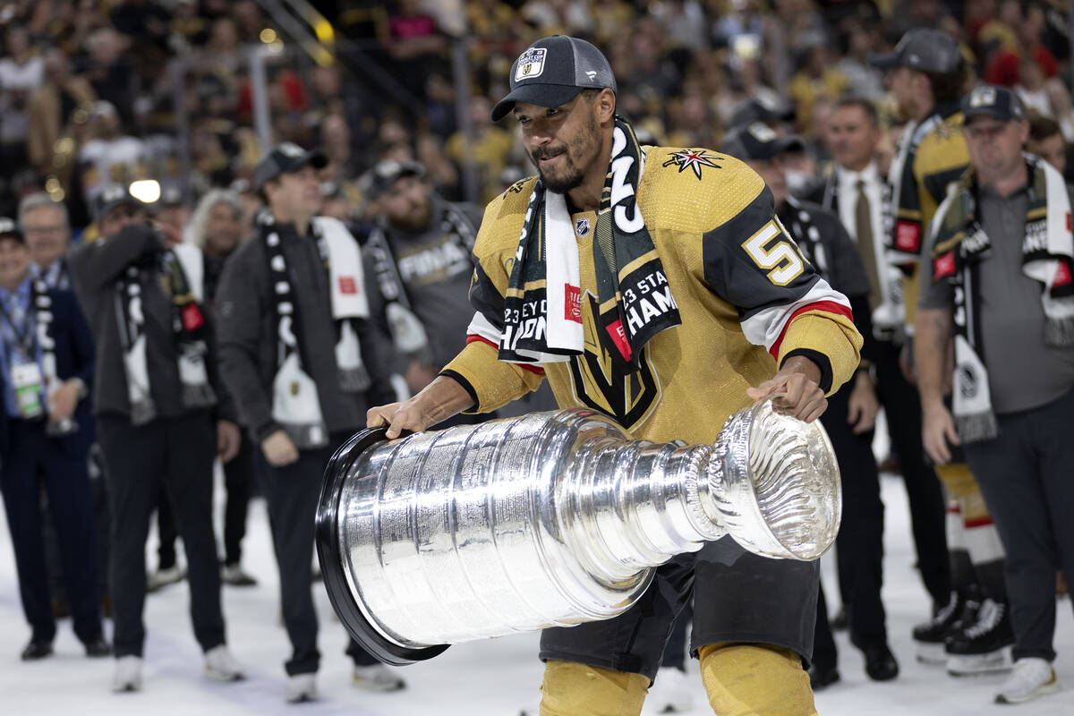 Golden Knights right wing Keegan Kolesar (55) celebrates with the Stanley Cup after winning the ...