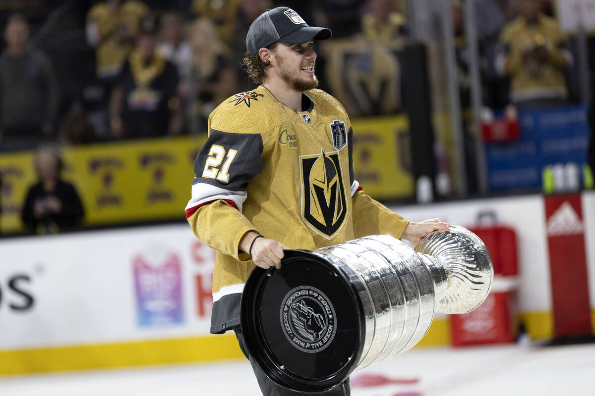 Golden Knights center Brett Howden (21) celebrates with the Stanley Cup after winning the NHL h ...