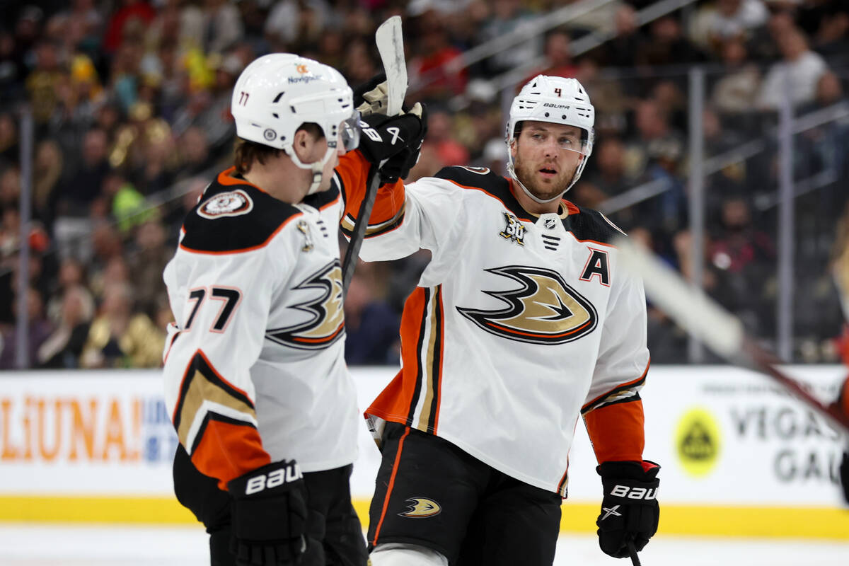 Ducks right wing Frank Vatrano (77) and defenseman Cam Fowler (4) celebrate a goal during the s ...