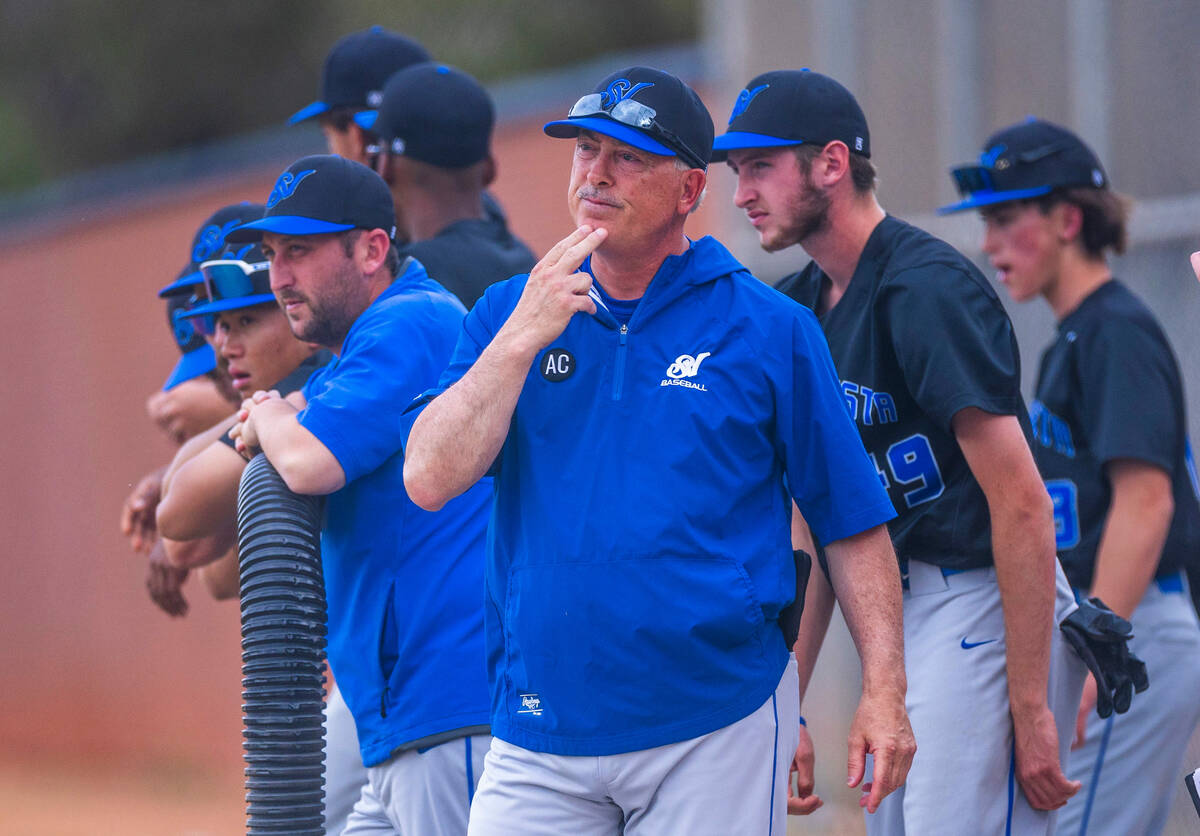 Sierra Vista head coach gives a signal to his players against Legacy during the first inning of ...