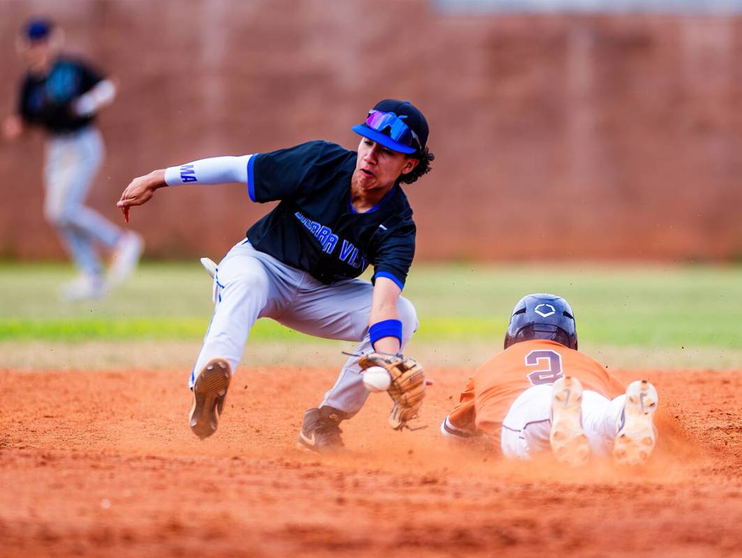 Sierra Vista infielder Ethan Villa (23) receives a throw just late as Legacy runner Kyler Avila ...