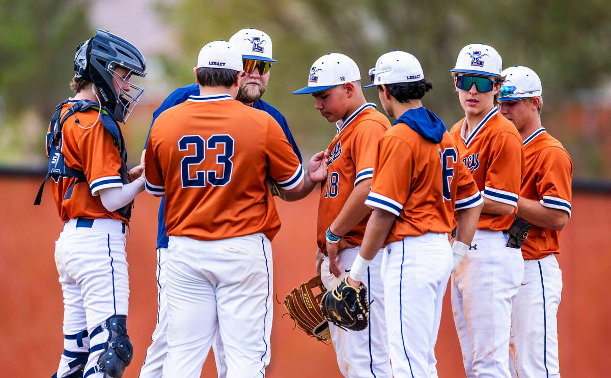 Legacy players and coach come together on the mound against Sierra Vista during the fifth innin ...