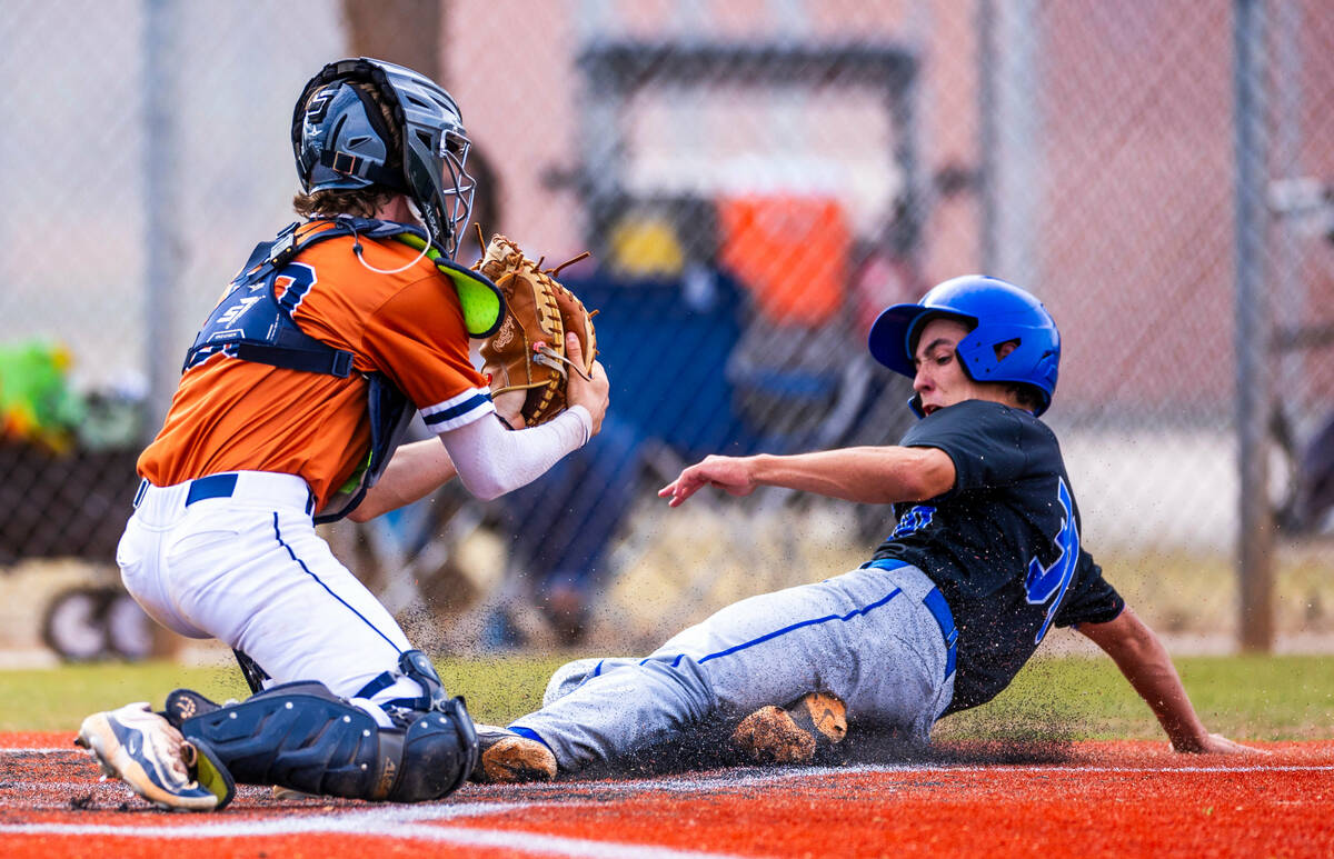 Sierra Vista batter Owen Angelo (30) slides home safely after a late throw to Legacy catcher Za ...