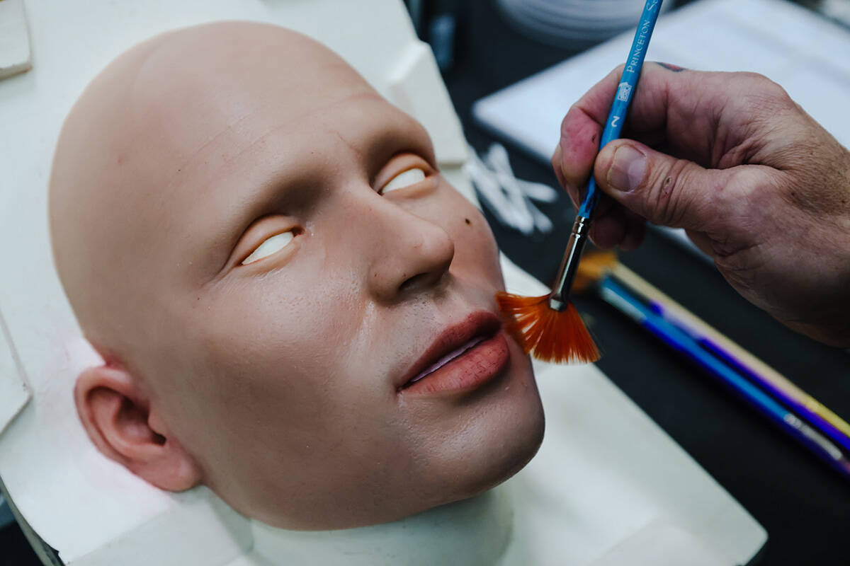 Founder Matt McMullen works on the face of a robot at the workshop for Realbotix, a company tha ...