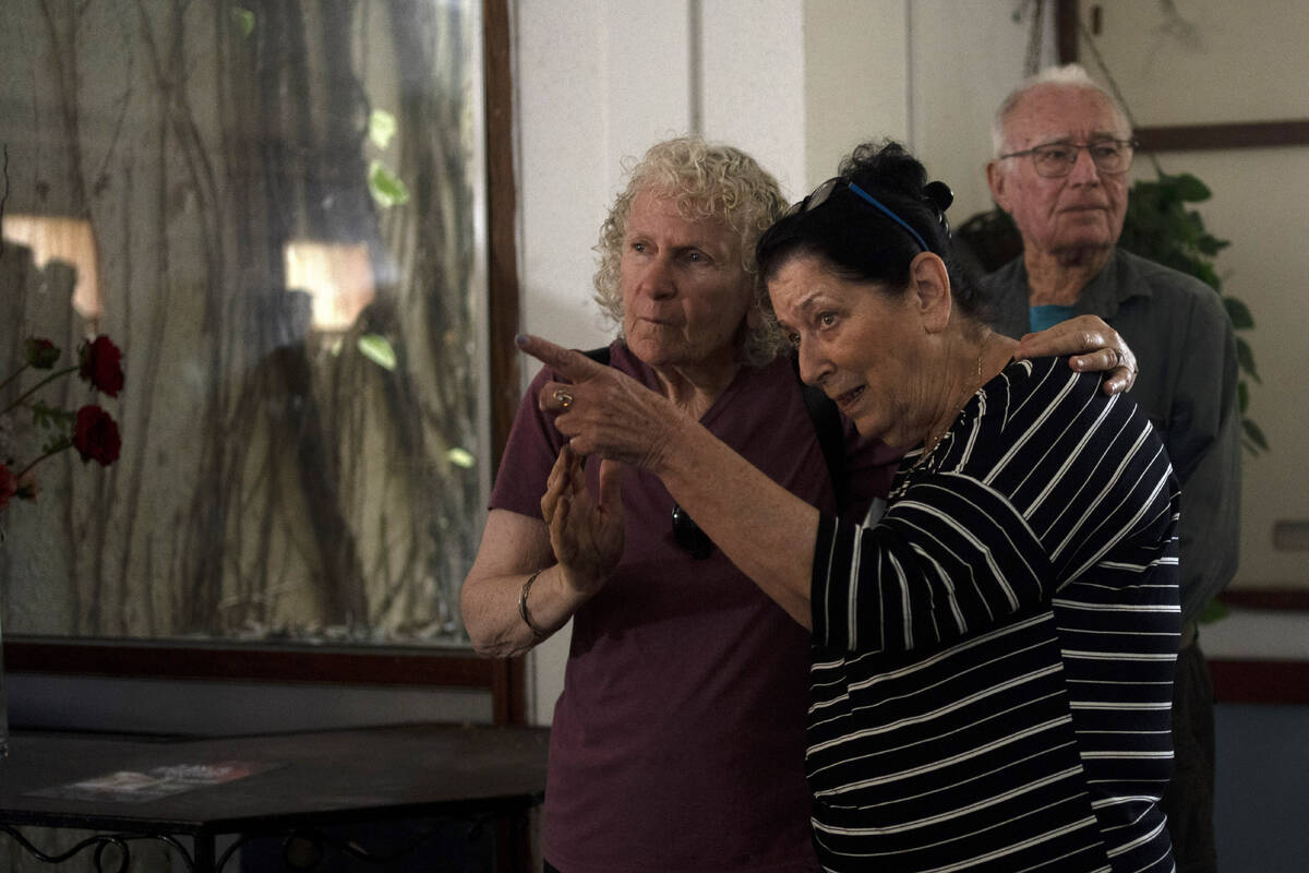 Osnat Peri, right, whose husband, Haim, is in Hamas captivity, takes part in a Passover Seder c ...