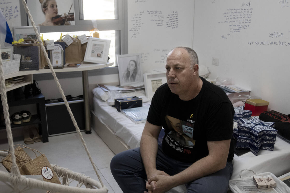 Shlomi Berger sits in his daughter's bedroom in Holon, Israel, Wednesday, April 17, 2024. Agam, ...