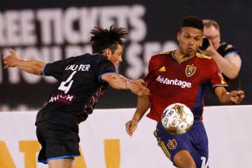 Real Salt Lake midfielder Maikel Chang (16) keeps a ball away from Las Vegas Lights FC defender ...