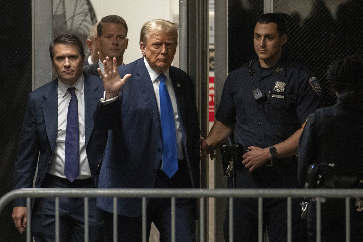 Former President Donald Trump returns from a break at Manhattan criminal court in New York on T ...