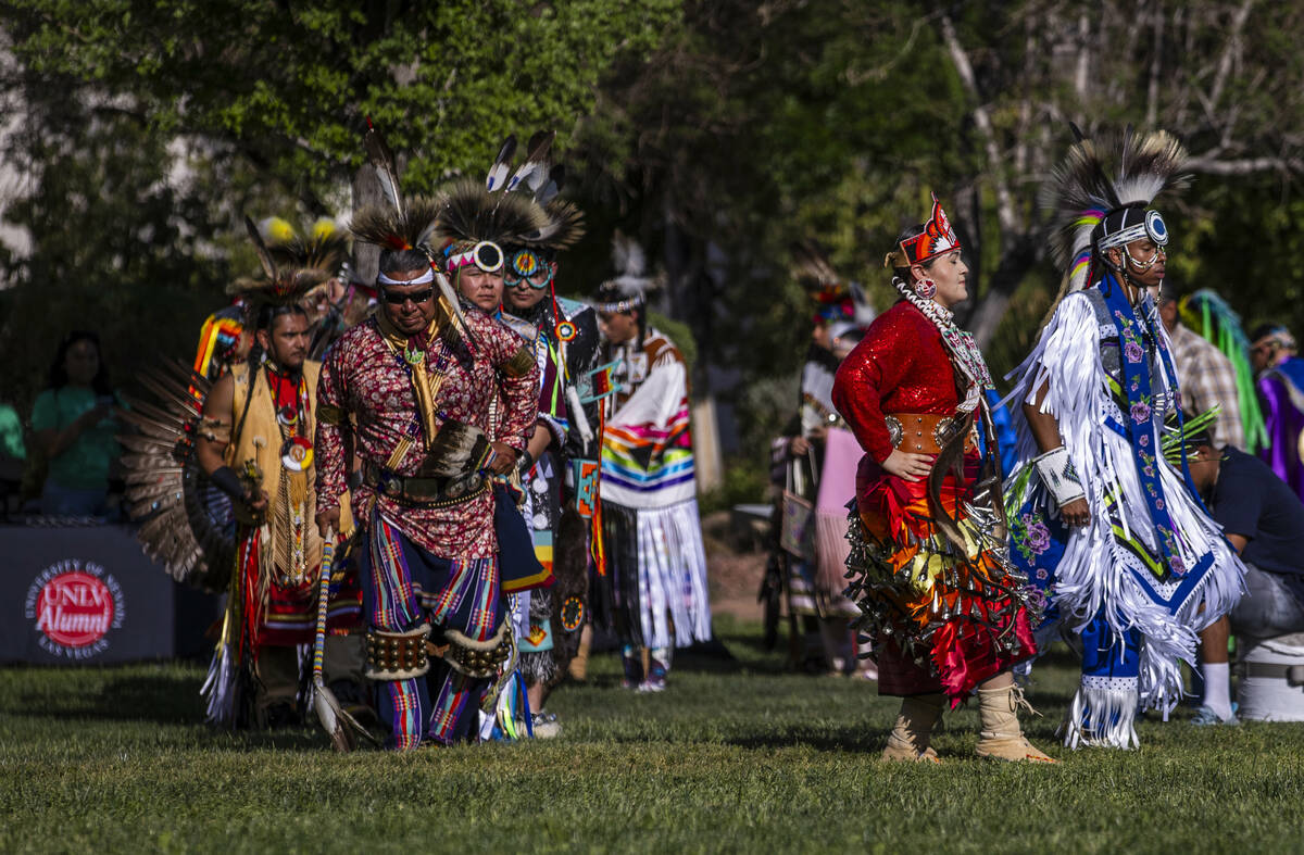 Dancers enter the grounds for the grand entry during the Powwow for the Planet at UNLV on Frida ...