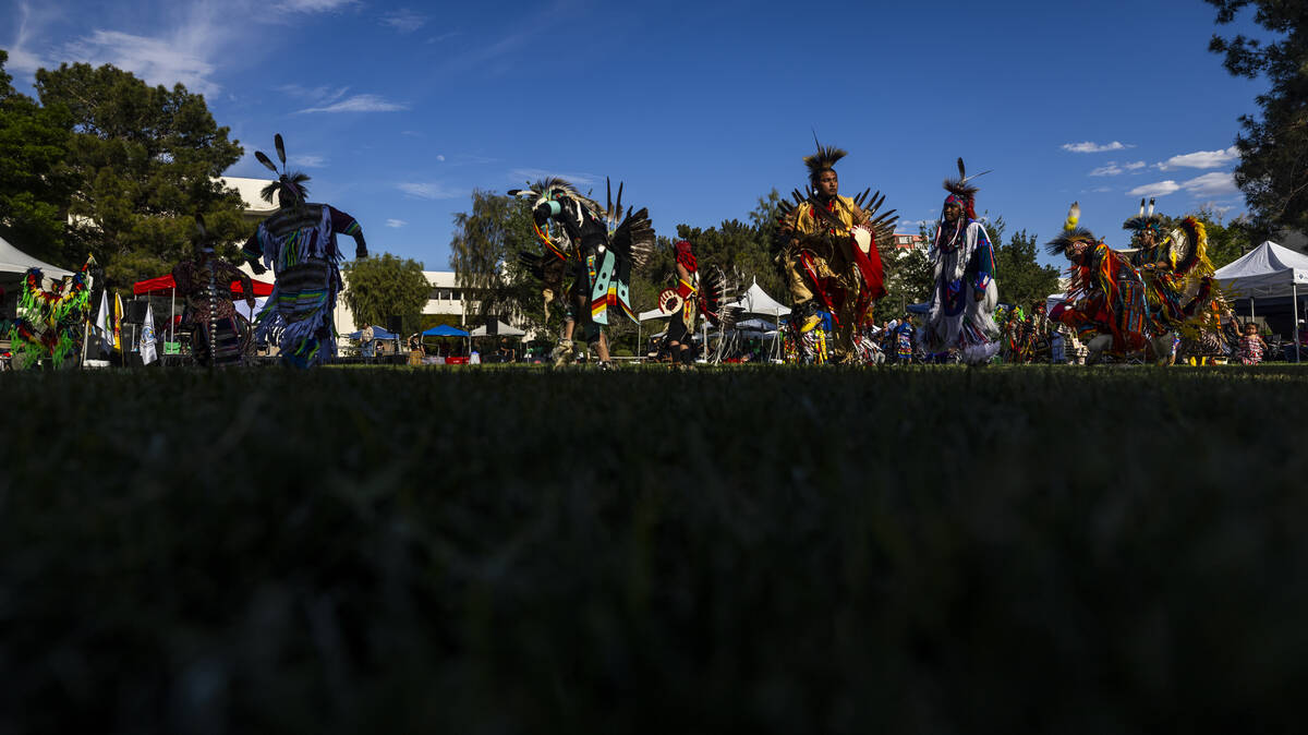 Dancers move about the grounds while performing for the crowd during the Powwow for the Planet ...