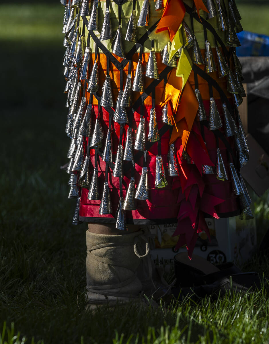 A jingle dress is one of the many colorful garments worn during the Powwow for the Planet at UN ...