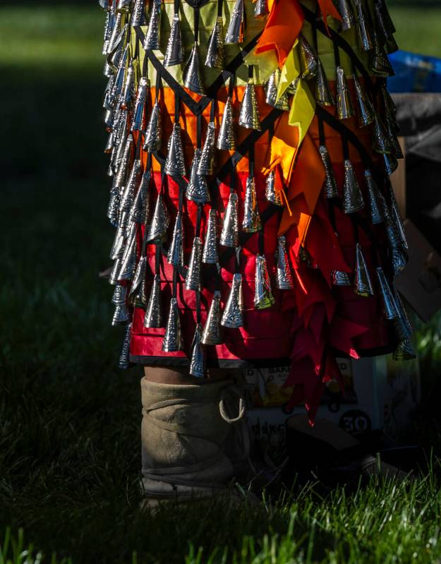 A jingle dress is one of the many colorful garments worn during the Powwow for the Planet at UN ...