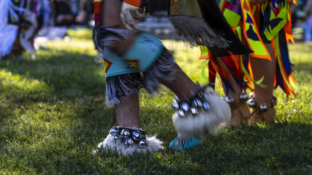 A dancer moves about the grounds while performing for the crowd during the Powwow for the Plane ...