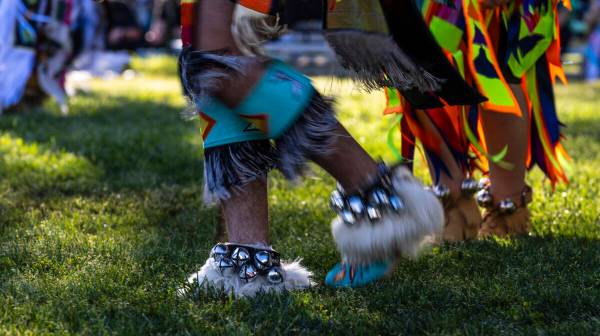 A dancer moves about the grounds while performing for the crowd during the Powwow for the Plane ...