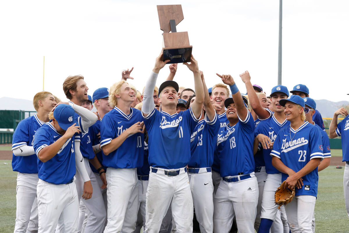 Bishop Gorman players raise their state title trophy after defeating Desert Oasis in a Class 5A ...