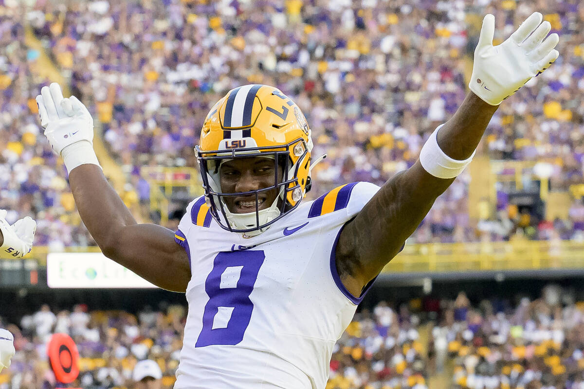 FILE - LSU wide receiver Malik Nabers (8) celebrates after a touchdown by teammate Brian Thomas ...