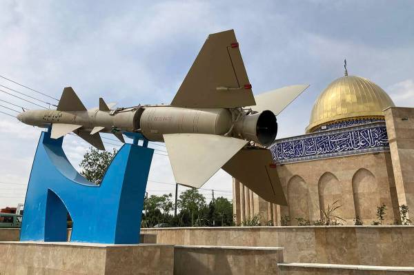 A missile is on display with a sign on it reading in Farsi: "Death to Israel" in fron ...