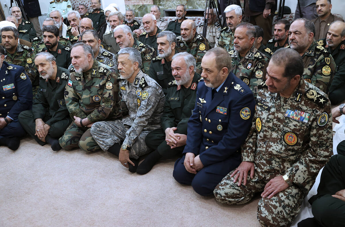 In this photo released by an official website of the office of the Iranian supreme leader, a gr ...