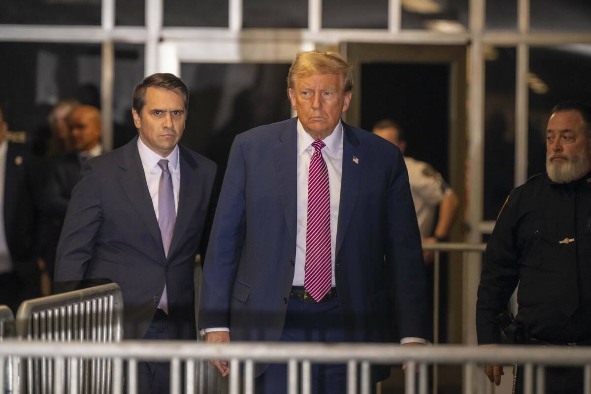 Former President Donald Trump, followed by his attorney Todd Blanche, left, exits the courtroom ...