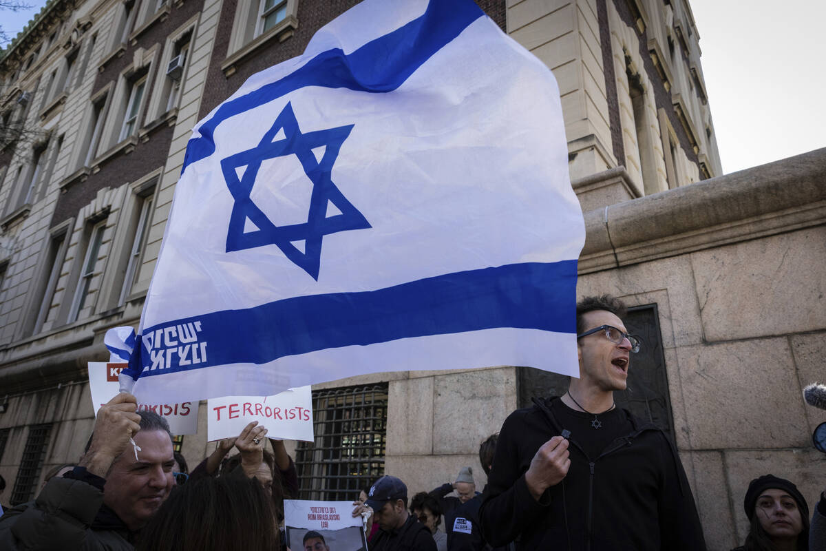 Columbia University assistant professor Shai Davidai, reads the names of Israeli hostages held ...