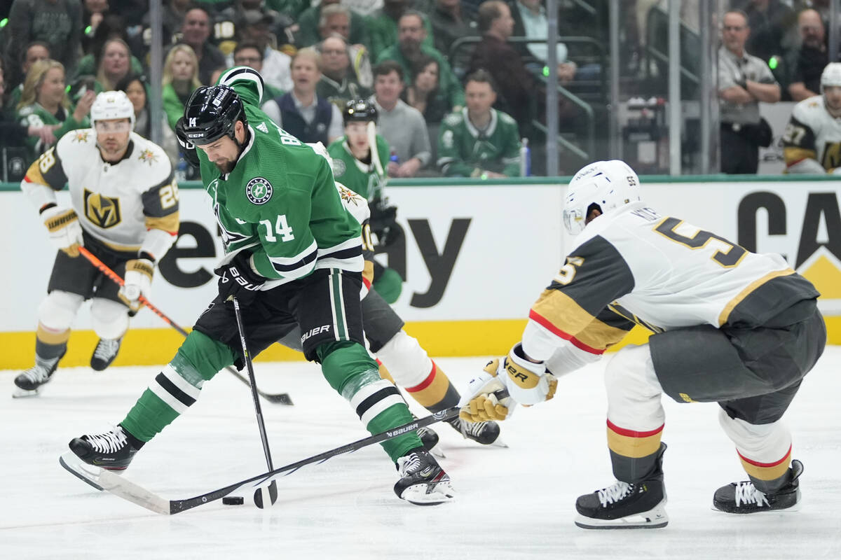 Dallas Stars left wing Jamie Benn (14) takes control of the puck in front of Vegas Golden Knigh ...