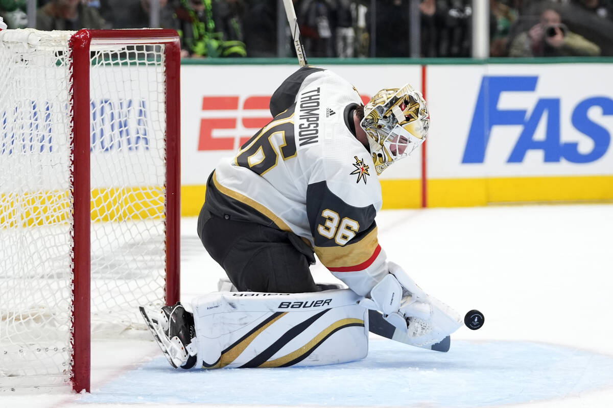 Vegas Golden Knights goaltender Logan Thompson reaches out to glove a shot from the Dallas Star ...