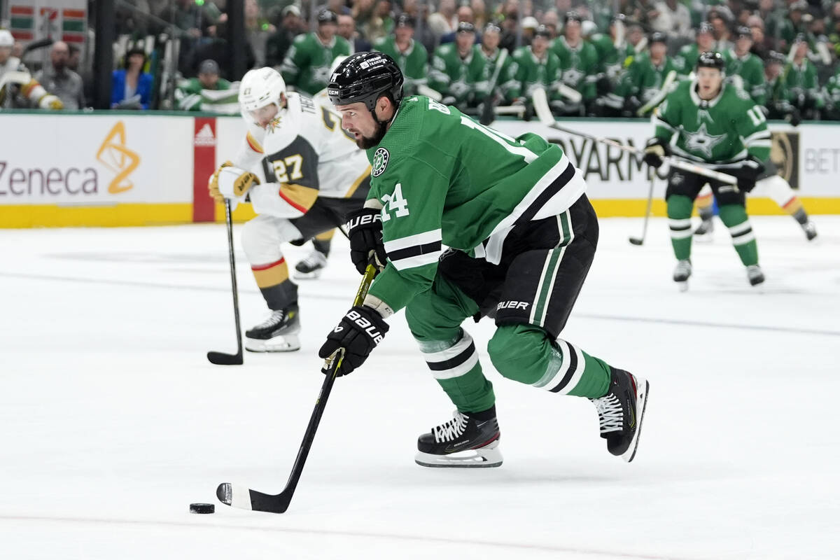 Dallas Stars left wing Jamie Benn (14) controls the puck on an attack just before shooting and ...
