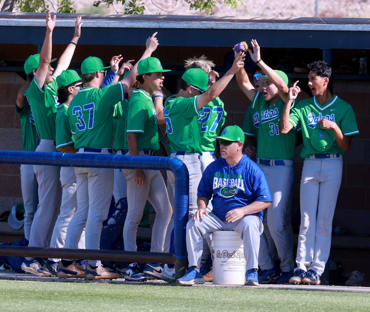 Green Valley players celebrate a run against Foothill in the 2nd inning of their baseball game ...