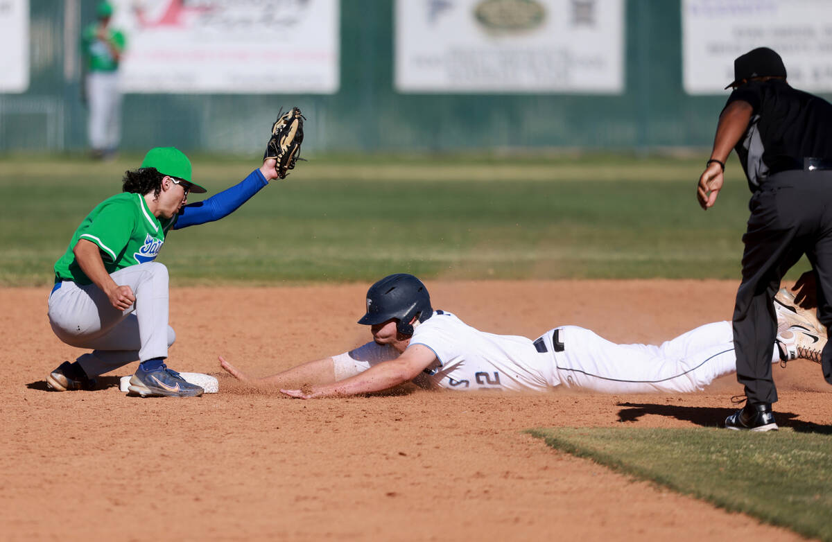 Foothill Logan Shanks (32) slides safely into second base under the tag of Green Valley shortst ...