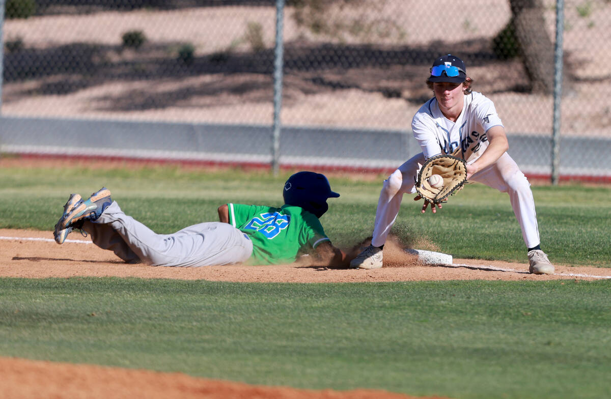 Green Valley Braden Chun (28) dives back safely to first base as Foothill first baseman Steven ...