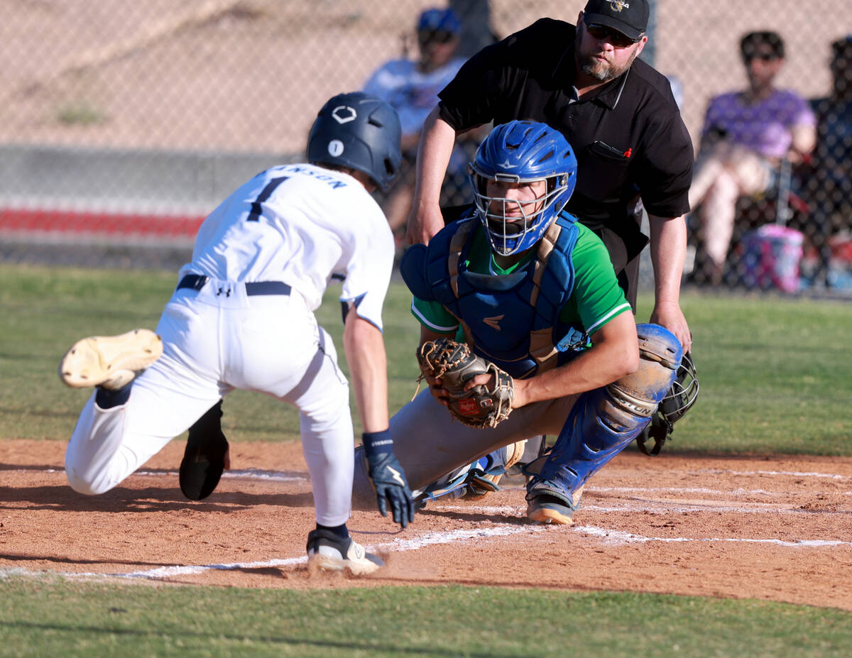 Green Valley catcher Bridger Knudson (8) prepares to tag out Foothill baserunner Jakob Hanson ( ...