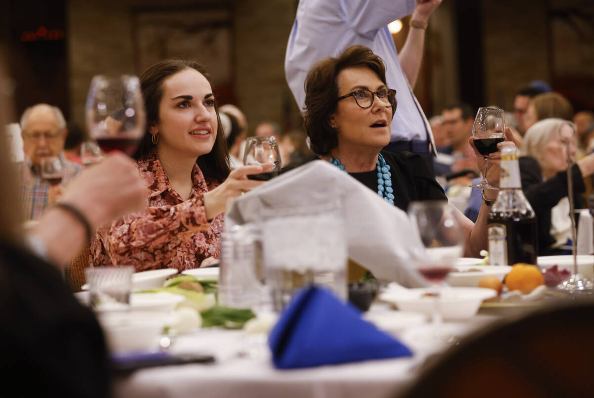 Sen. Jacky Rosen, D-Nev., right, alongside daughter, Miranda, look on as the first cup of wine ...