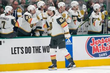 Vegas Golden Knights right wing Mark Stone (61) celebrates with the bench after scoring in the ...
