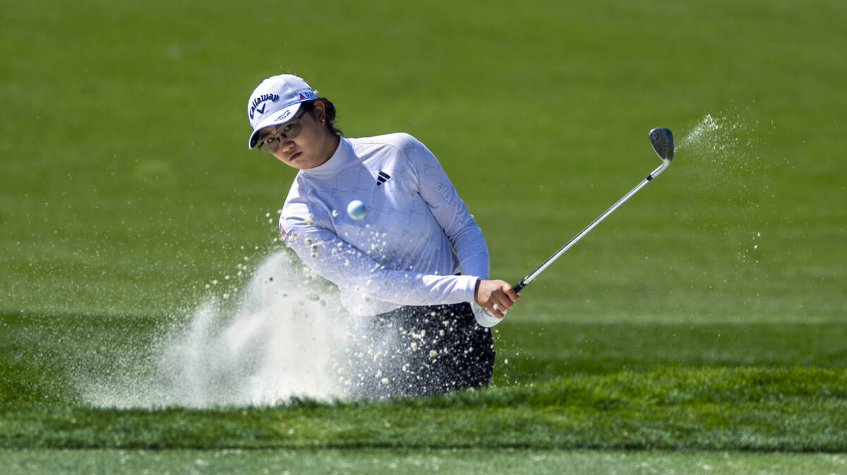 Rose Zhang digs out of a sand trap on hole #7 during the second day of the LPGA T-Mobile Match ...