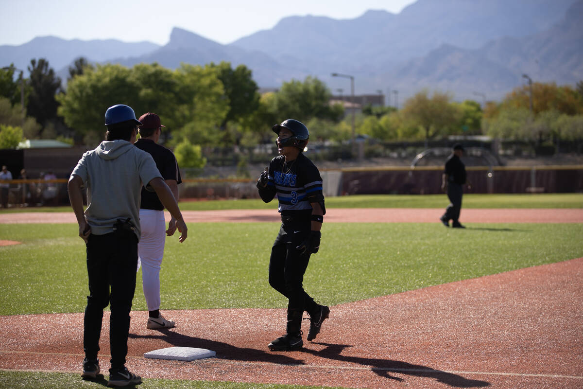 Basic shortstop Ty Southisene (3) celebrates after hitting a single during a high school baseba ...