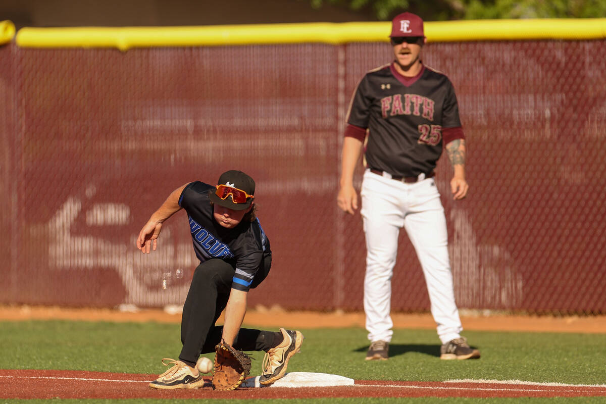 Basic first baseman Randall Riley (53) catches for an out on Faith Lutheran during a high schoo ...