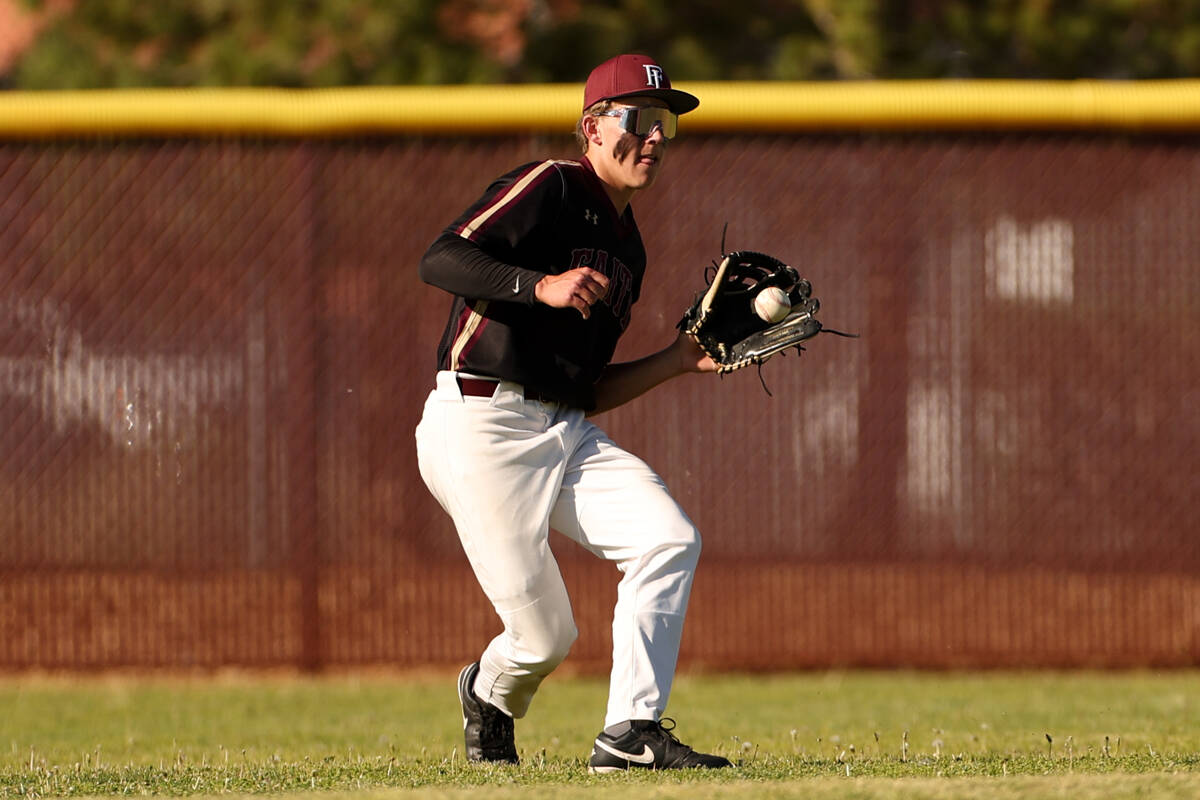 Faith Lutheran outfielder Nathan Keyes (3) catches for an out during a high school baseball gam ...