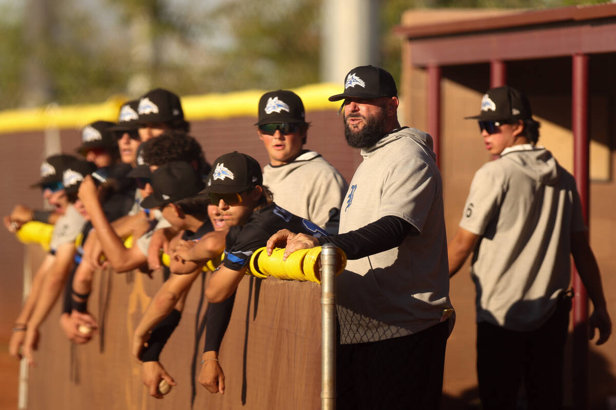 Basic interim head coach Gino DiMaria stands in the dugout during a high school baseball game a ...
