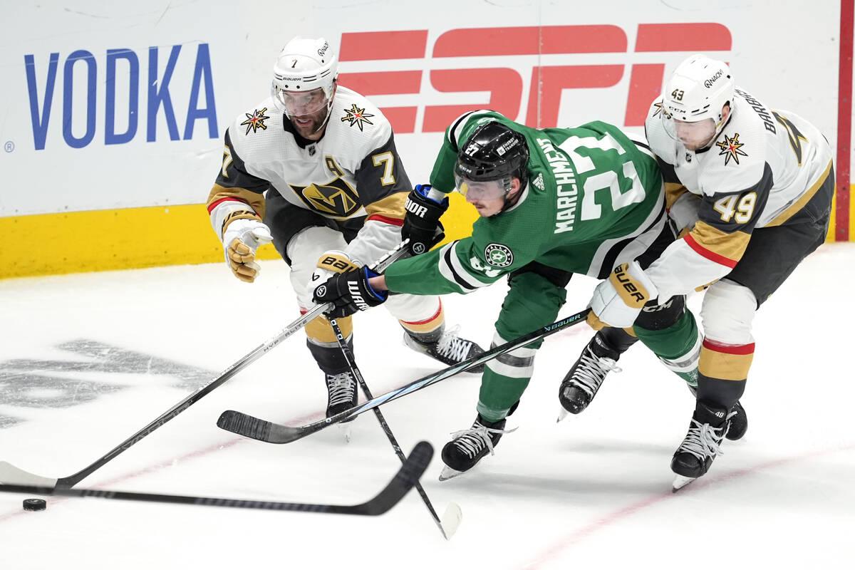 Dallas Stars left wing Mason Marchment (27) makes a pass to the front of the net as Vegas Golde ...