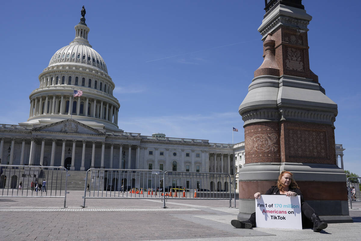 Jennifer Gay, a TikTok content creator, sits outside the U.S. Capitol, Tuesday, April 23, 2024, ...